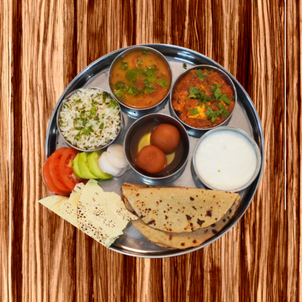 Homely Royal Feast meal plan by WarmCrave featuring roti, rice, curry, vegetables, salad, and dessert. Freshly prepared meal for tiffin service in Bhopal.